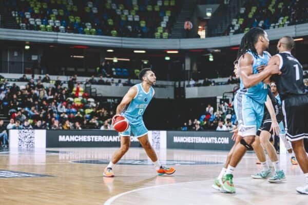 Gladiators player with the ball during a thrilling overtime win in London.