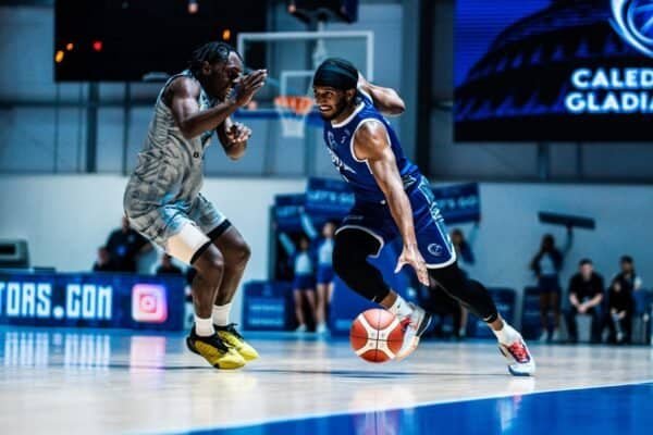 Gladiators player dribbling past opponent during a home game.